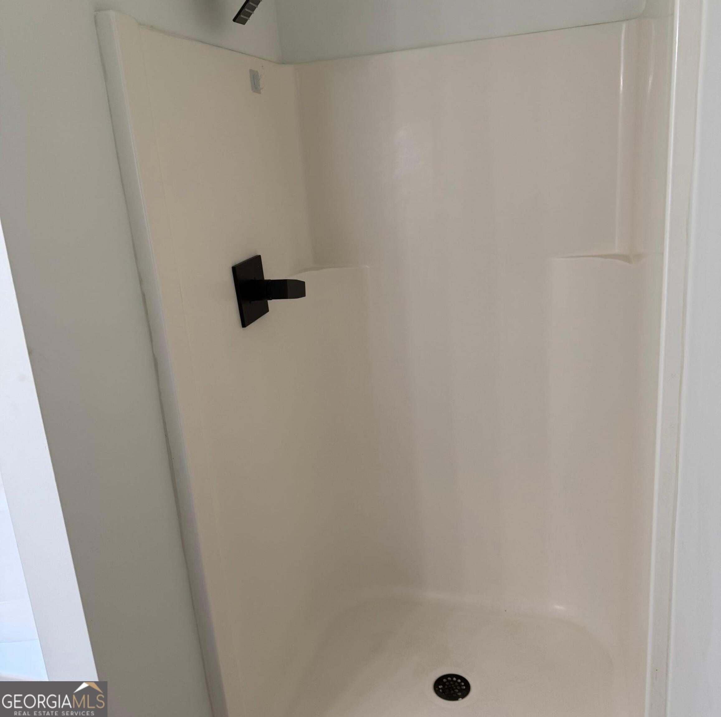 5471 Walnut Lane Lithonia, GA 30038 - Photo 23 of 40 a bathroom with a shower