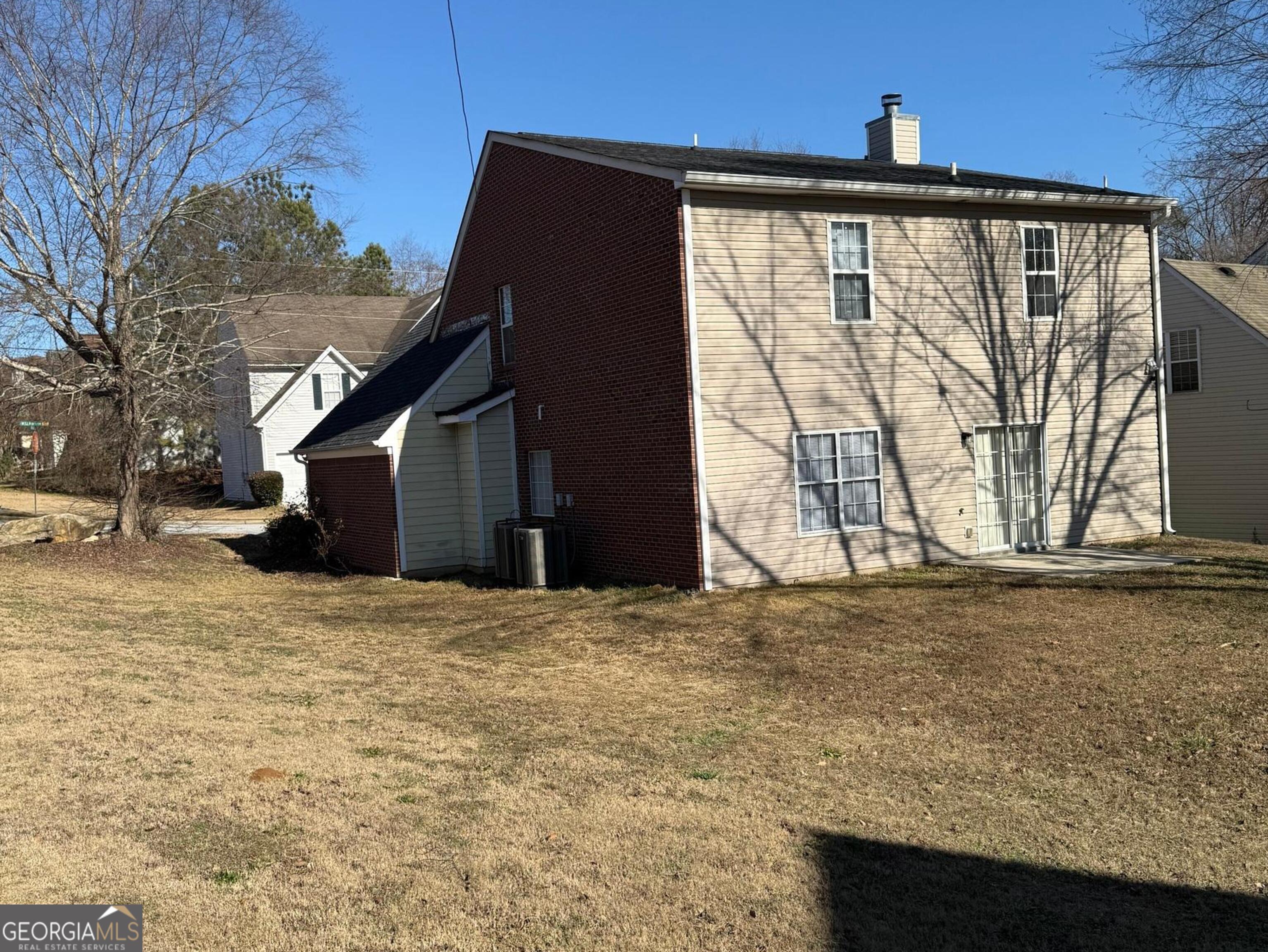 5471 Walnut Lane Lithonia, GA 30038 - Photo 39 of 40 a view of a house with a wooden fence