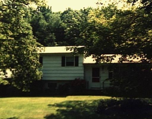 115 Flint Ridge Road Monroe, CT 06468 - Photo 1 of 1 a view of a house with a yard