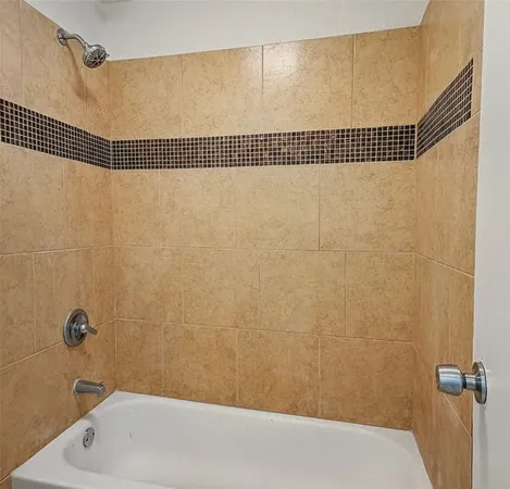a bathroom with a shower and a bathtub