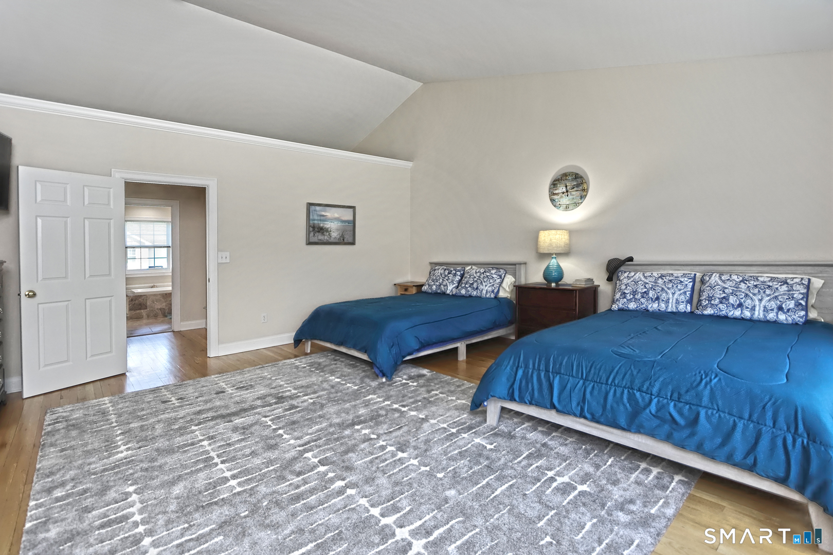 102 Lantern Court, Unit 102 Clinton, CT 06413 - Photo 28 of 36 a bedroom with two beds and a dresser