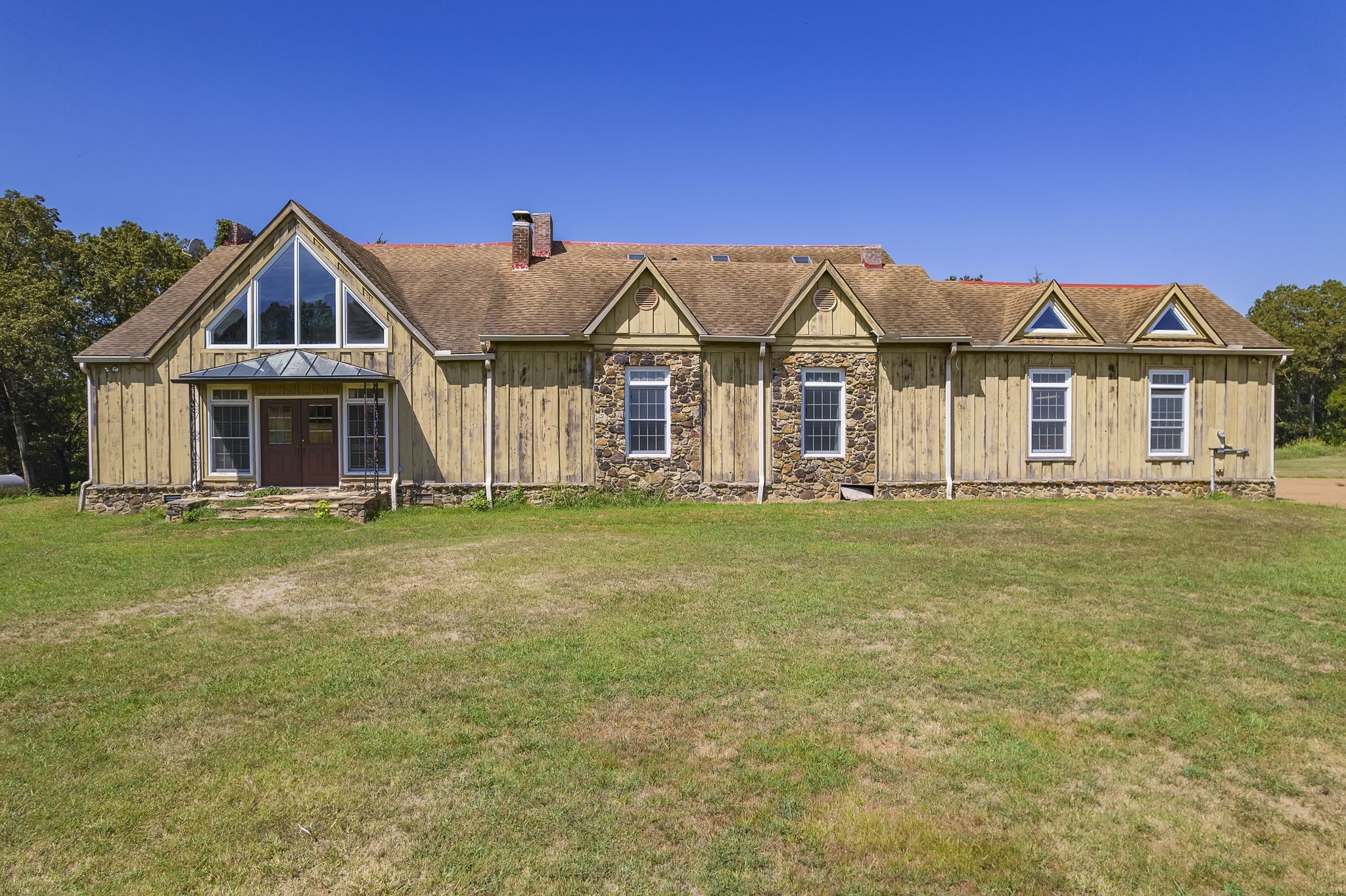 290 Leeford Lane Cedar Grove, TN 38321 - Photo 16 of 54 a front view of a house with a garden