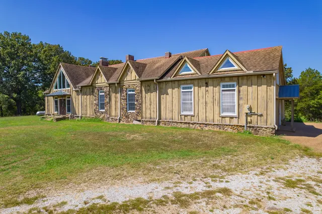 a backyard of a house with lots of green space