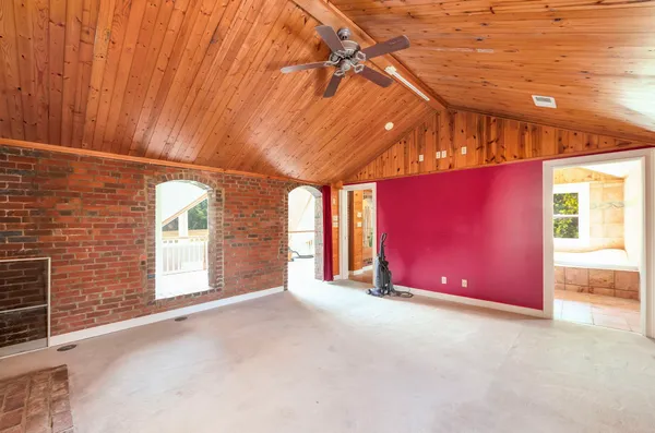 a view of an empty room with a fireplace