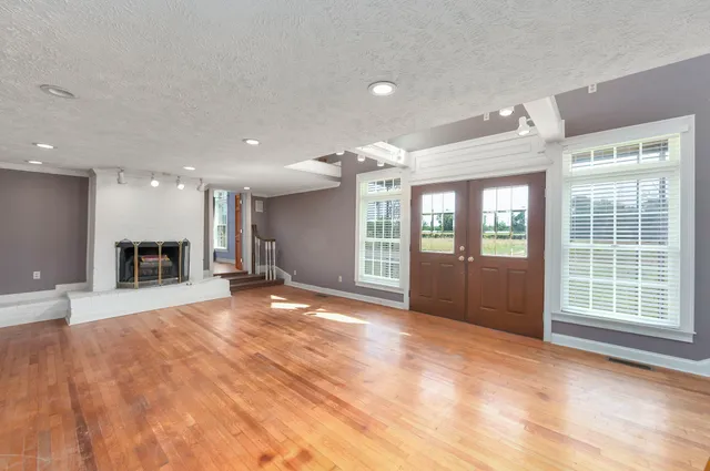 a lobby with furniture and a rug