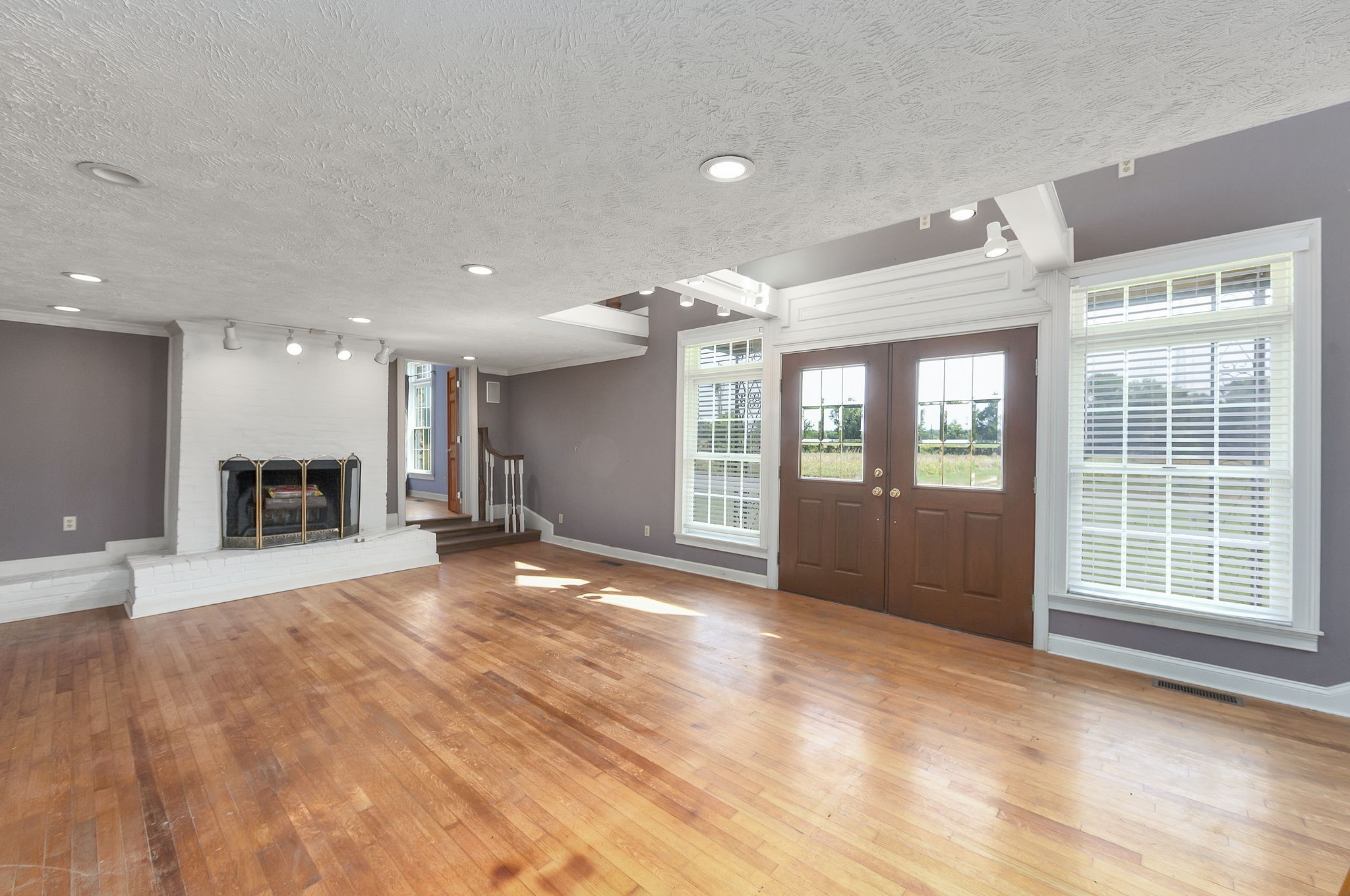 290 Leeford Lane Cedar Grove, TN 38321 - Photo 44 of 54 a view of an empty room with a fireplace and a window