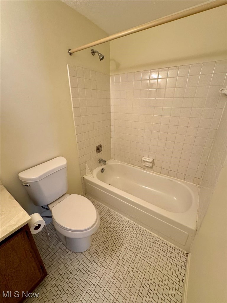 17073 Drake Road Strongsville, OH 44136 - Photo 30 of 50 Bathroom featuring vanity, washtub / shower combination, and tile patterned floors