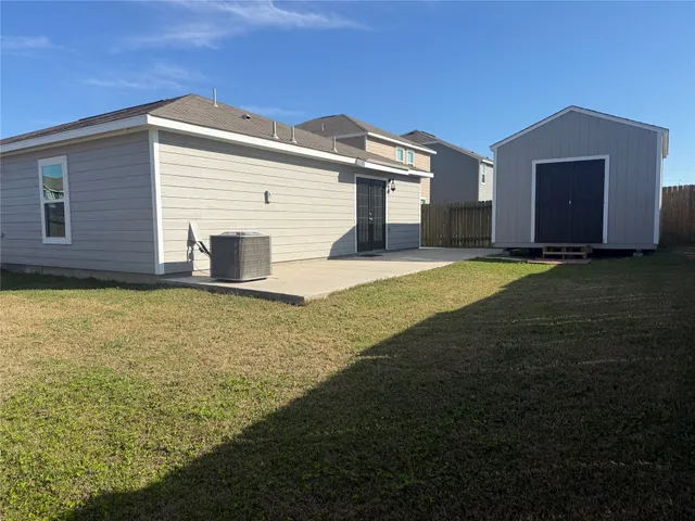 a view of an house with backyard space and garden