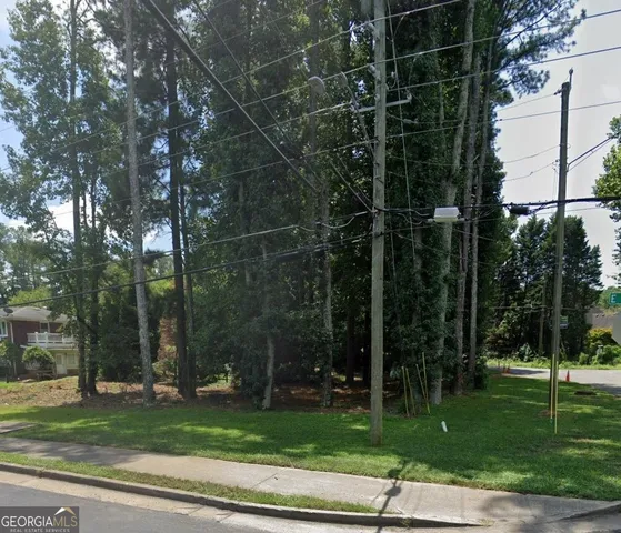 a view of a park with large trees