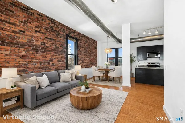 a living room with furniture and a rug