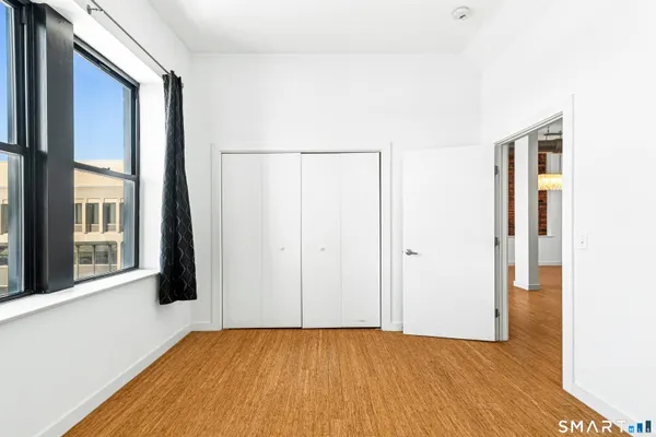 a bathroom with a toilet sink and a window
