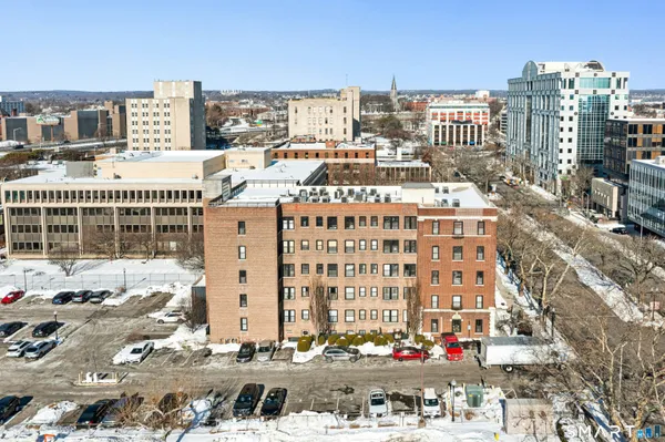 an aerial view of a city with tall buildings