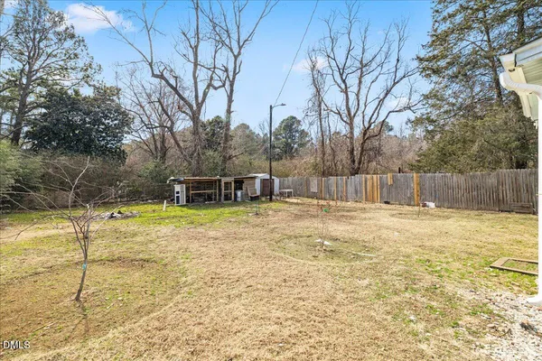 a view of a swimming pool with a house