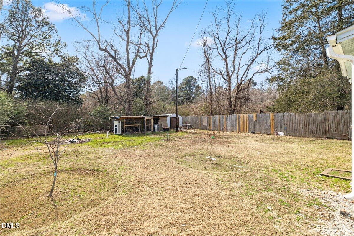 3133 Tryon Road Raleigh, NC 27603 - Photo 26 of 31 a view of a swimming pool with a house