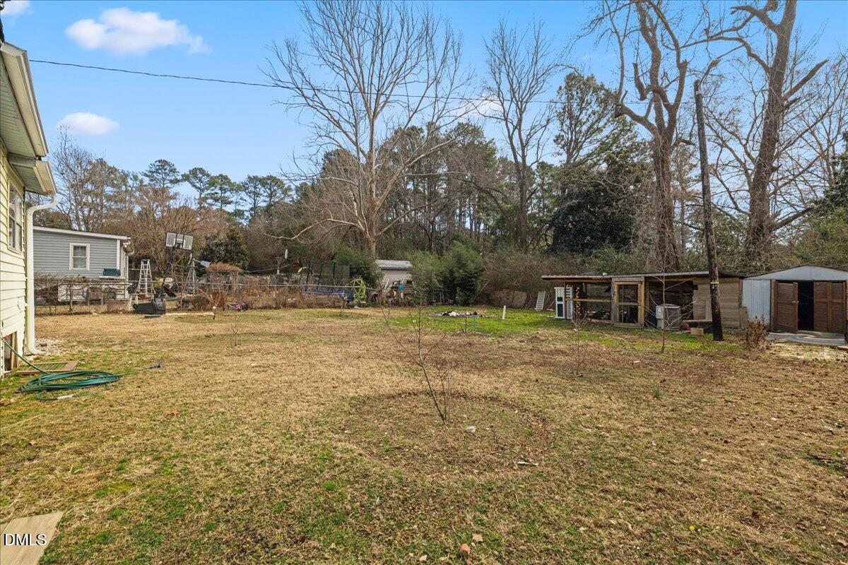 3133 Tryon Road Raleigh, NC 27603 - Photo 27 of 31 a view of a house with a yard