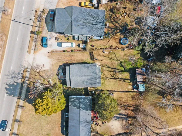 a aerial view of a house with a yard