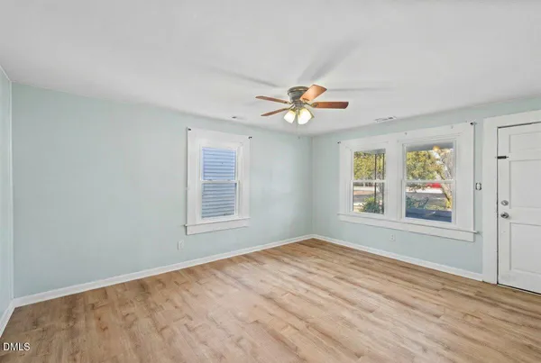 a view of an empty room with a window