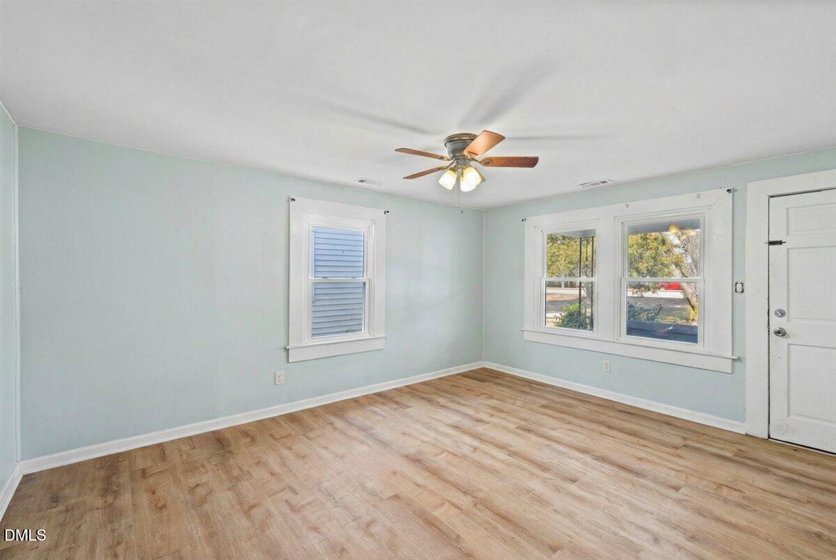 3133 Tryon Road Raleigh, NC 27603 - Photo 8 of 31 a view of an empty room with a window