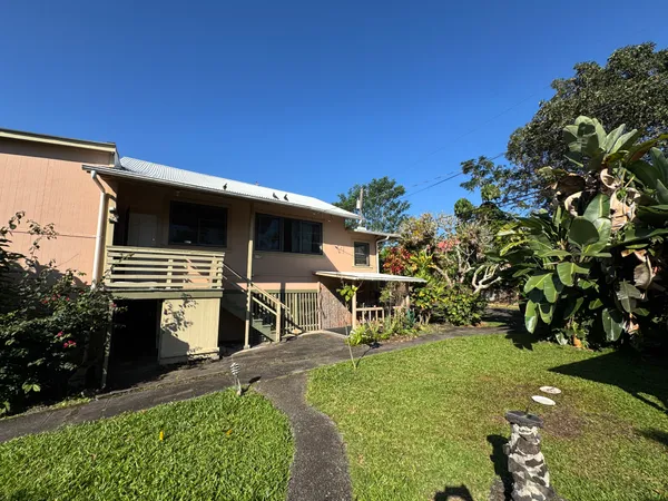 a view of an chairs and table in the patio