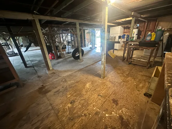 a view of a room with wooden floor