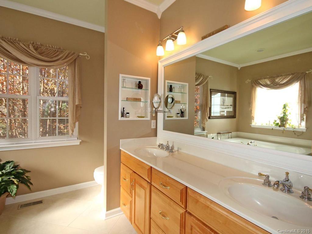 8729 Riverwood Road, Unit 53 Terrell, NC 28682 - Photo 17 of 24 a spacious bathroom with a sink double vanity and a mirror