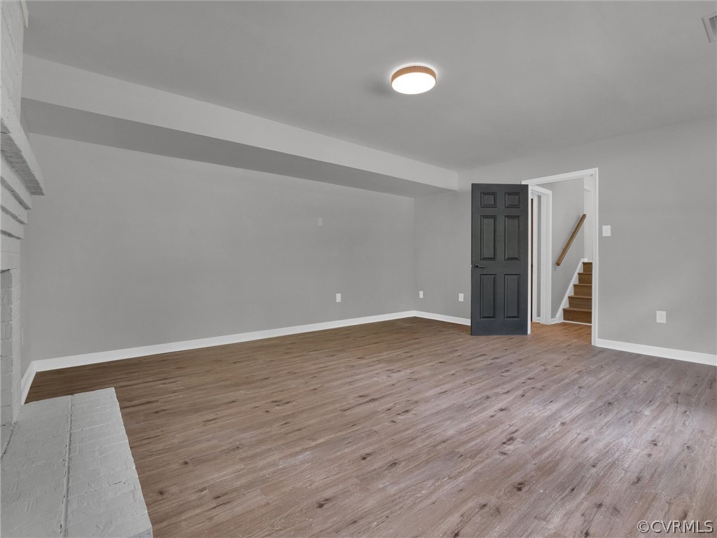 731 Adkins Road Chesterfield, VA 23236 - Photo 11 of 37 a view of an empty room with wooden floor and a window
