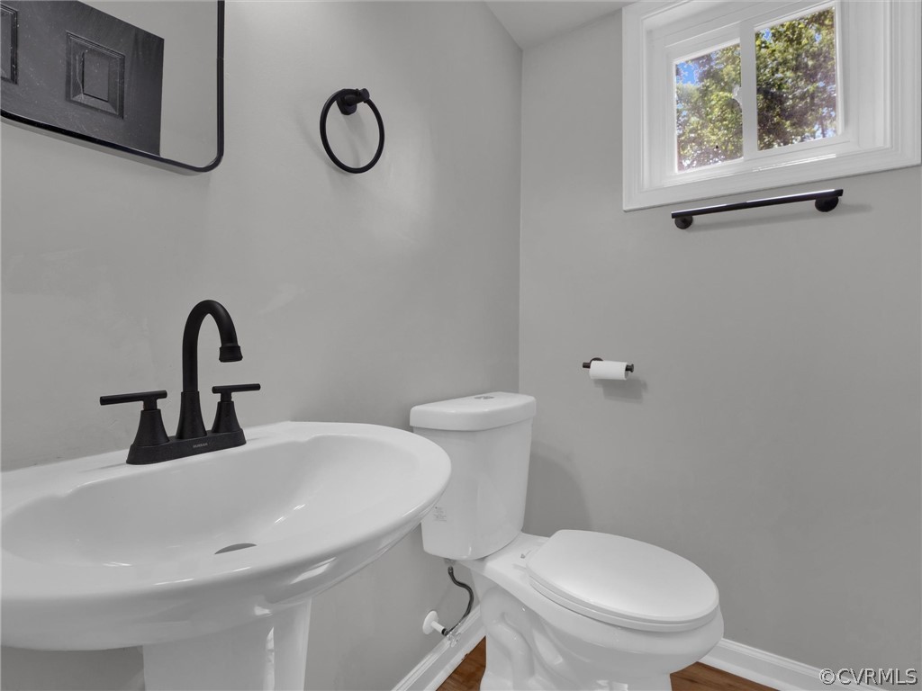 731 Adkins Road Chesterfield, VA 23236 - Photo 12 of 37 a bathroom with a toilet sink and mirror
