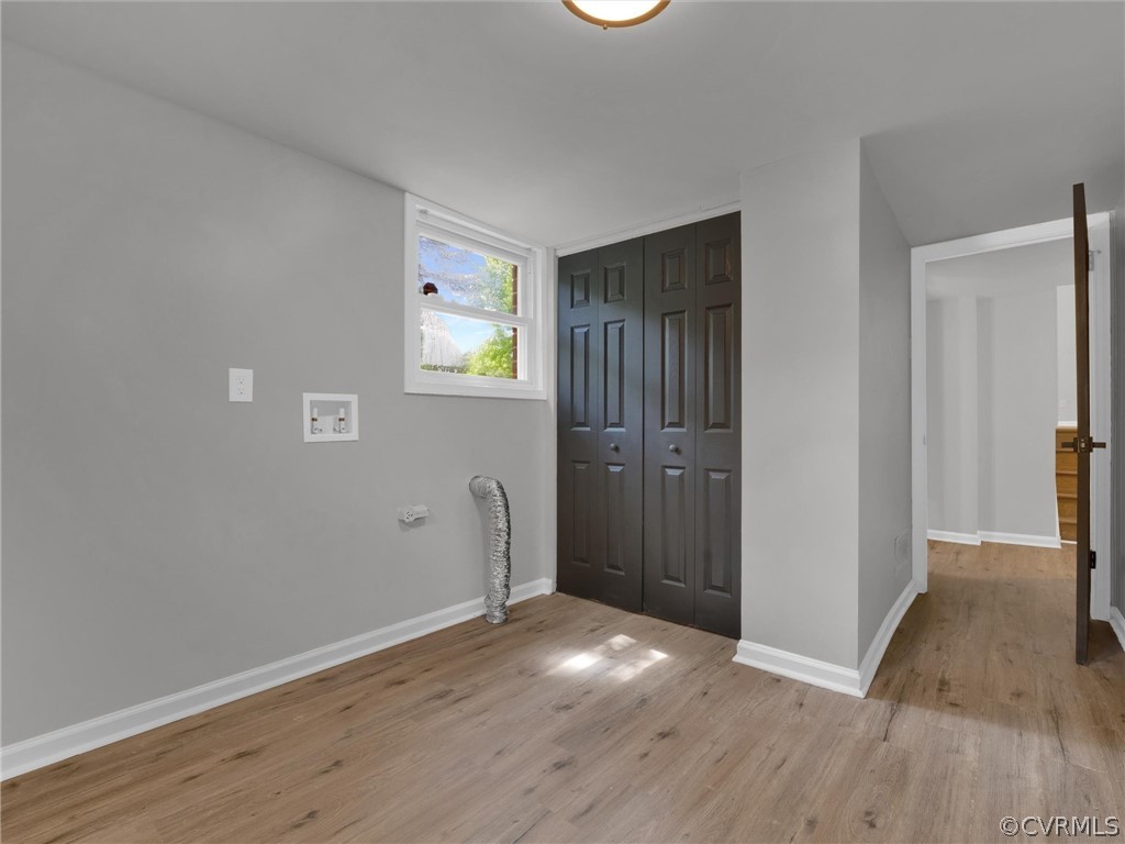 731 Adkins Road Chesterfield, VA 23236 - Photo 14 of 37 an empty room with wooden floor and windows