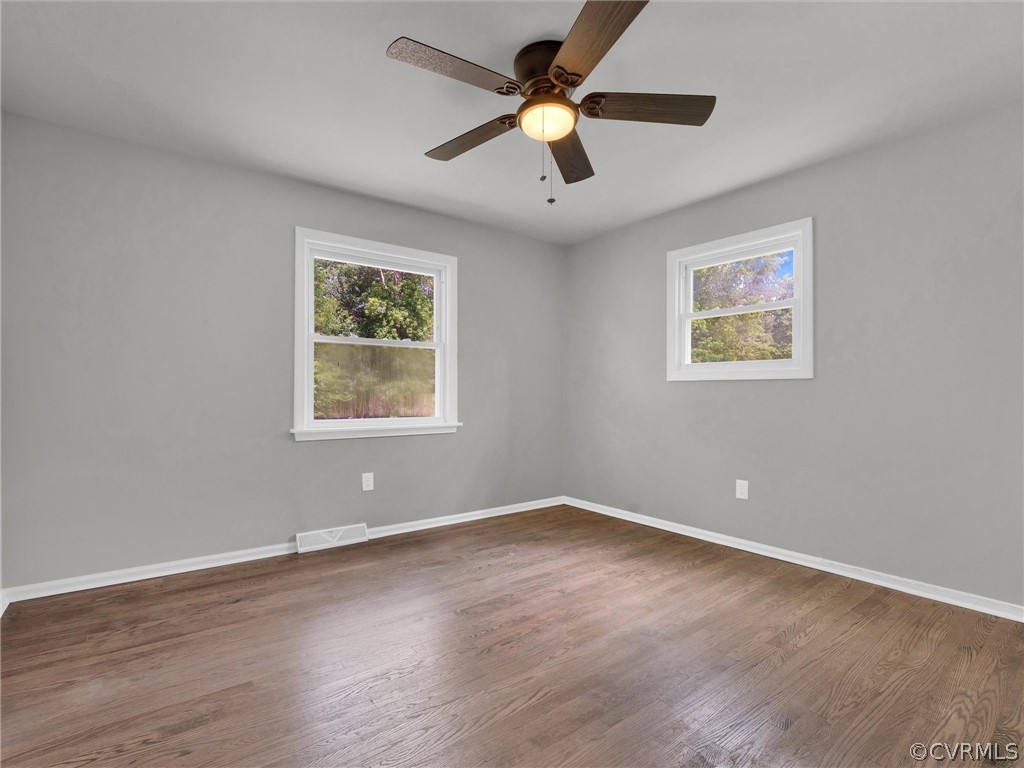 731 Adkins Road Chesterfield, VA 23236 - Photo 23 of 37 a view of room with window ceiling fan and wooden floor