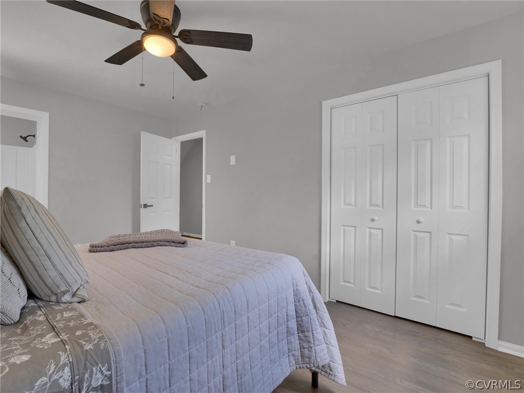 731 Adkins Road Chesterfield, VA 23236 - Photo 24 of 37 a bedroom with a bed and a chandelier