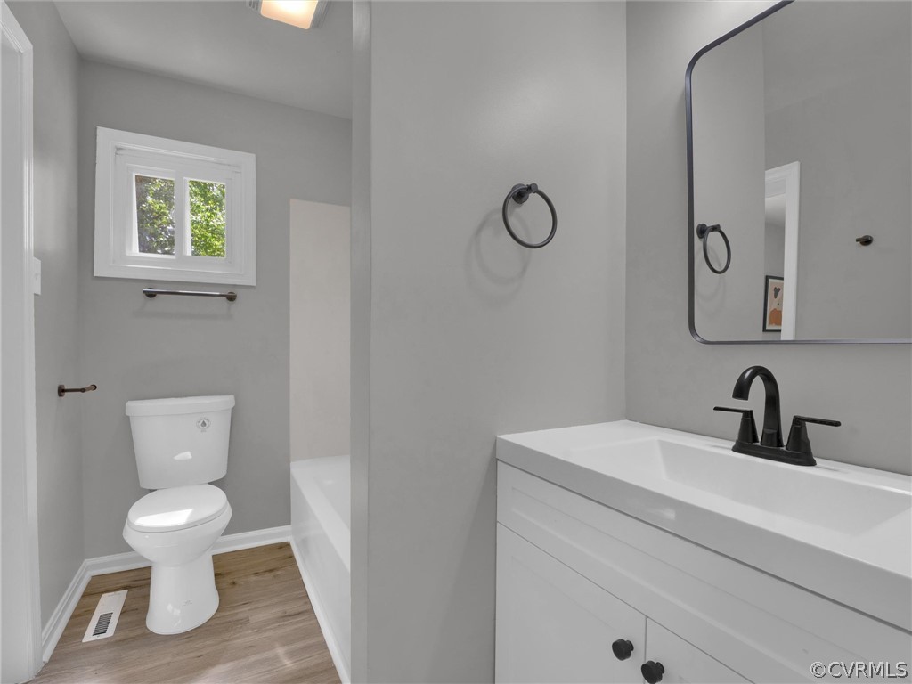 731 Adkins Road Chesterfield, VA 23236 - Photo 25 of 37 a bathroom with a toilet sink and mirror