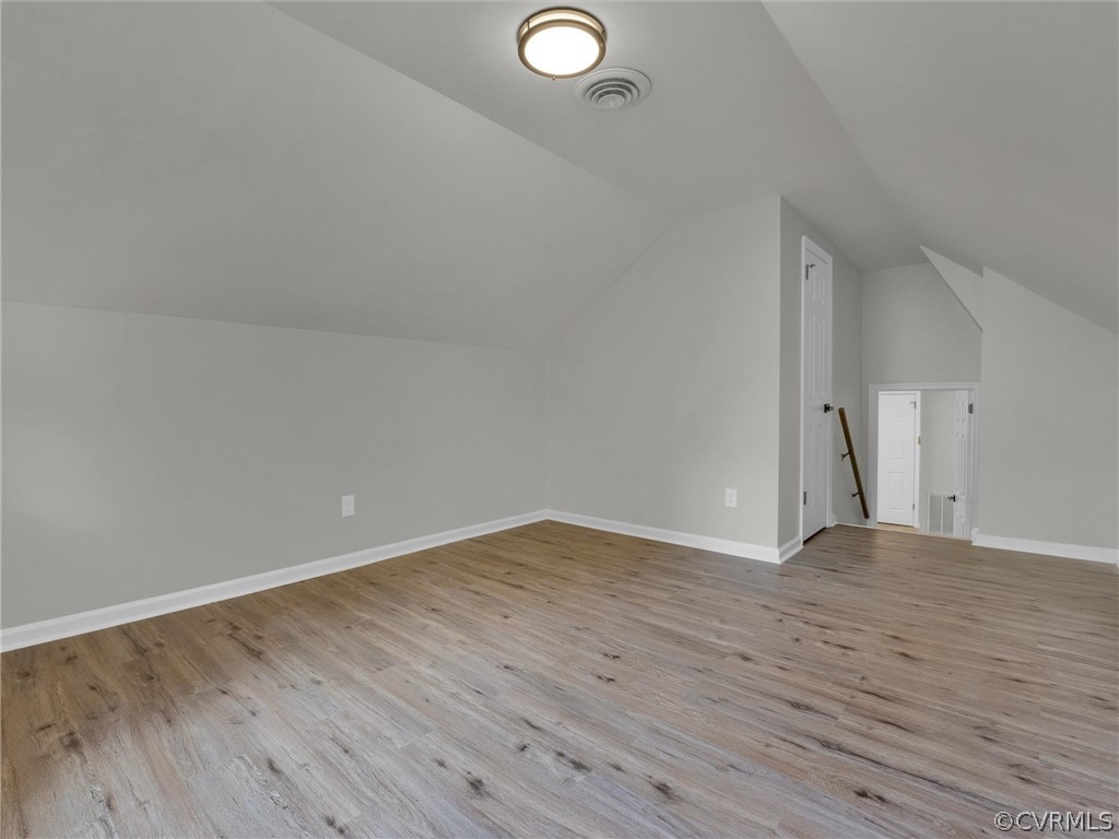731 Adkins Road Chesterfield, VA 23236 - Photo 29 of 37 a view of an empty room with wooden floor and a window