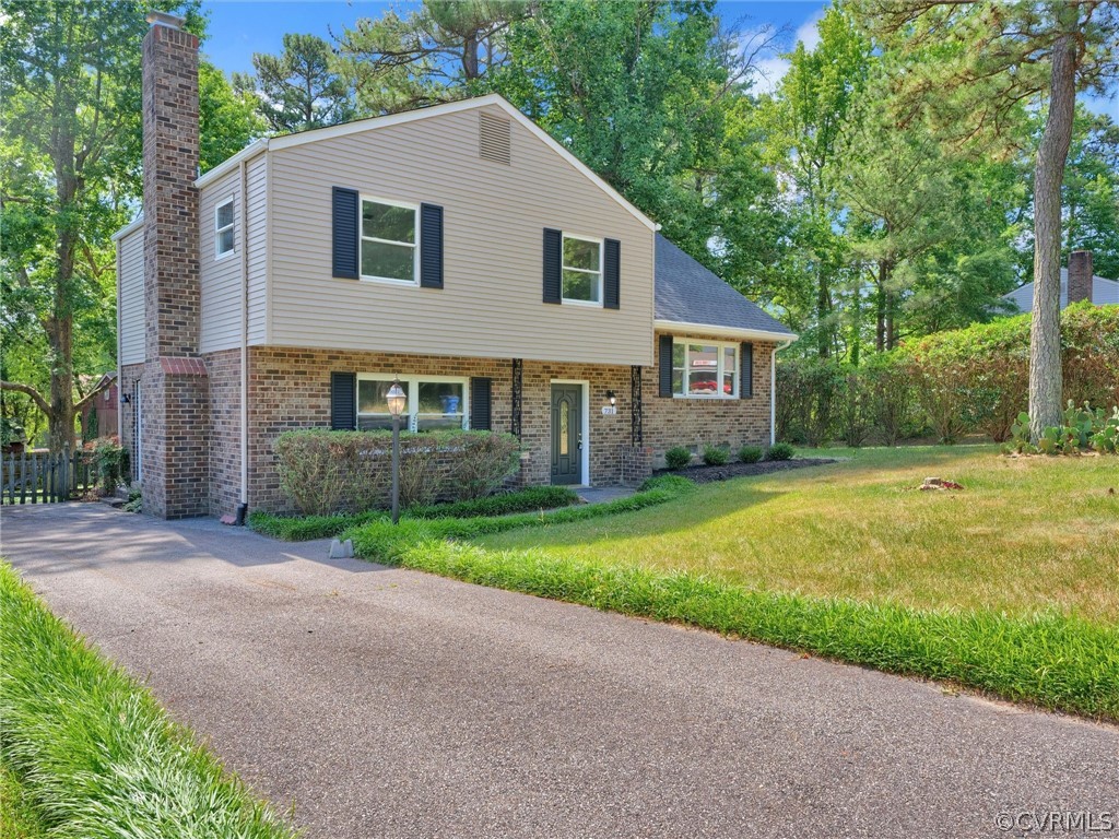 731 Adkins Road Chesterfield, VA 23236 - Photo 3 of 37 a front view of house with yard and green space