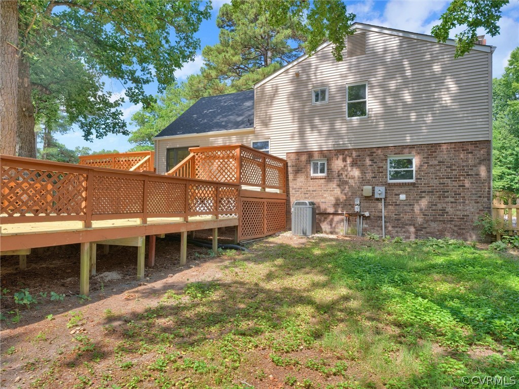 731 Adkins Road Chesterfield, VA 23236 - Photo 32 of 37 a backyard of a house with table and chairs