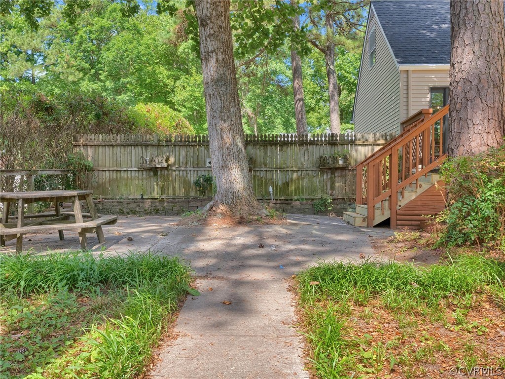 731 Adkins Road Chesterfield, VA 23236 - Photo 34 of 37 a backyard of a house with lots of green space and fountain