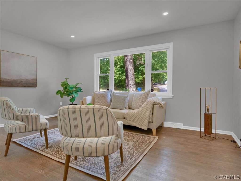 731 Adkins Road Chesterfield, VA 23236 - Photo 7 of 37 a living room with furniture and a potted plant