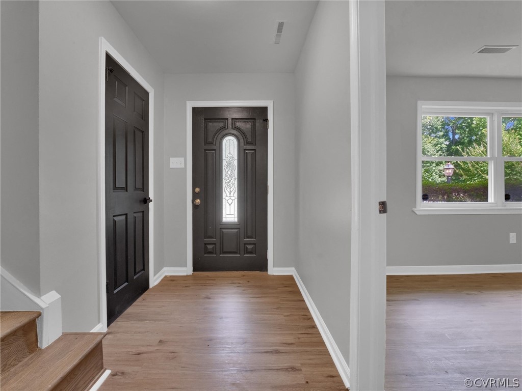 731 Adkins Road Chesterfield, VA 23236 - Photo 8 of 37 a view of a hallway with wooden floor and closet