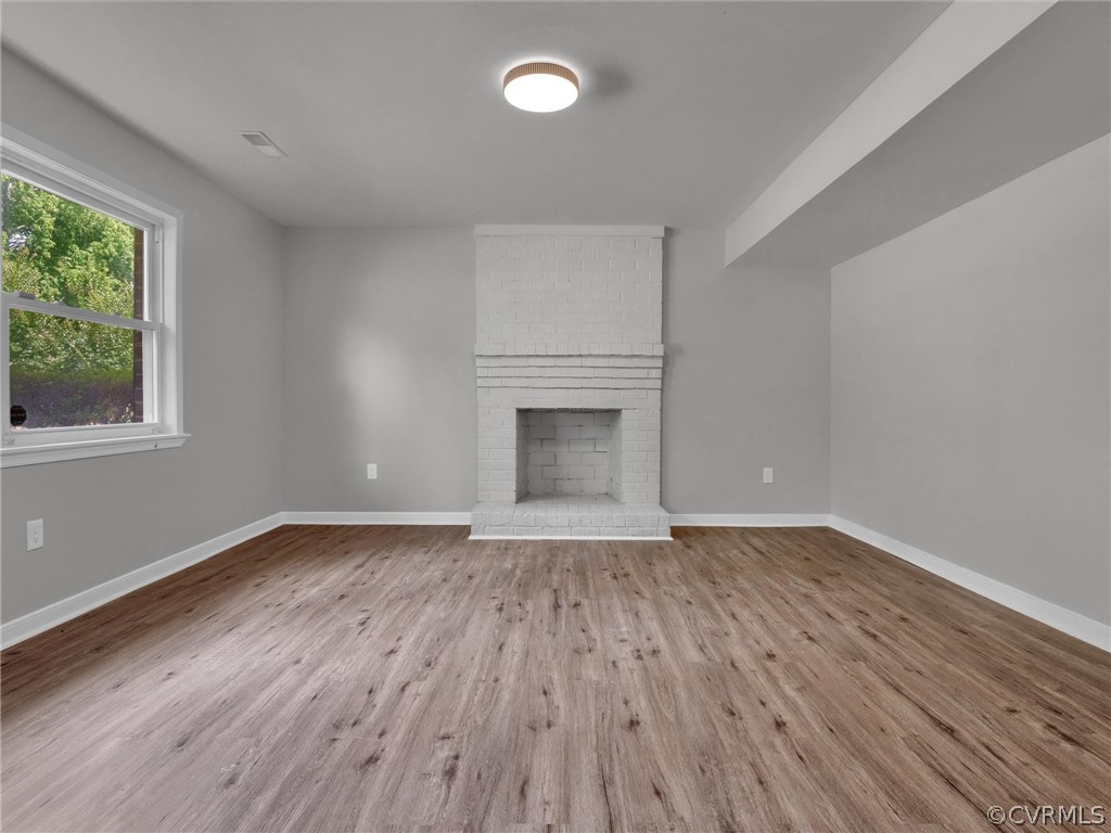 731 Adkins Road Chesterfield, VA 23236 - Photo 10 of 37 a view of an empty room with wooden floor and a window