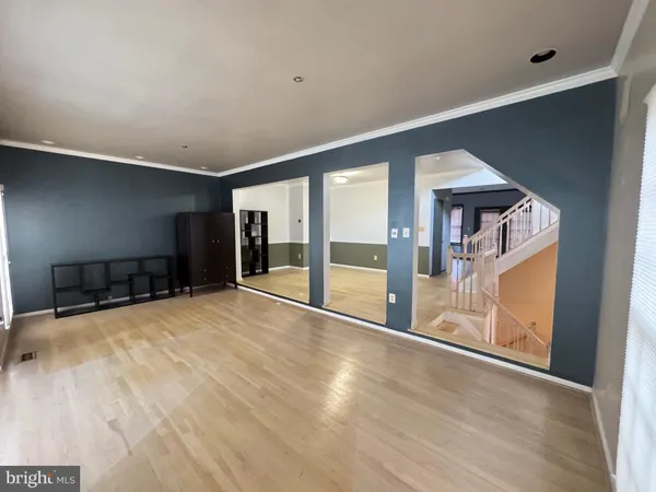a view of an empty room with glass door