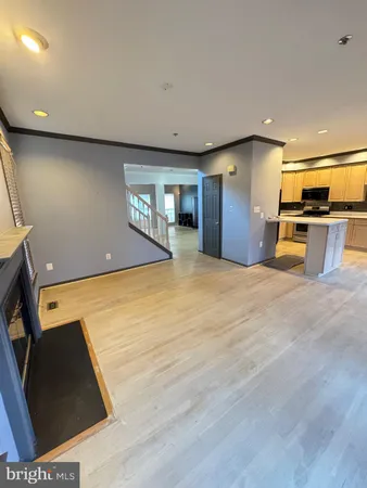 a view of a kitchen with a sink and a window
