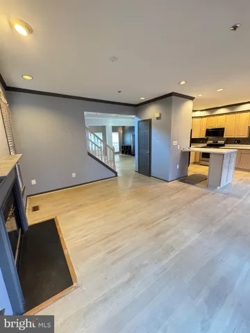 a view of a kitchen with a sink and a window