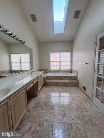 a view of a kitchen with sink and window