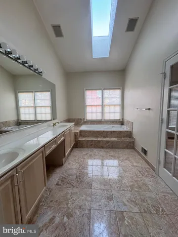 a view of a kitchen with sink and window