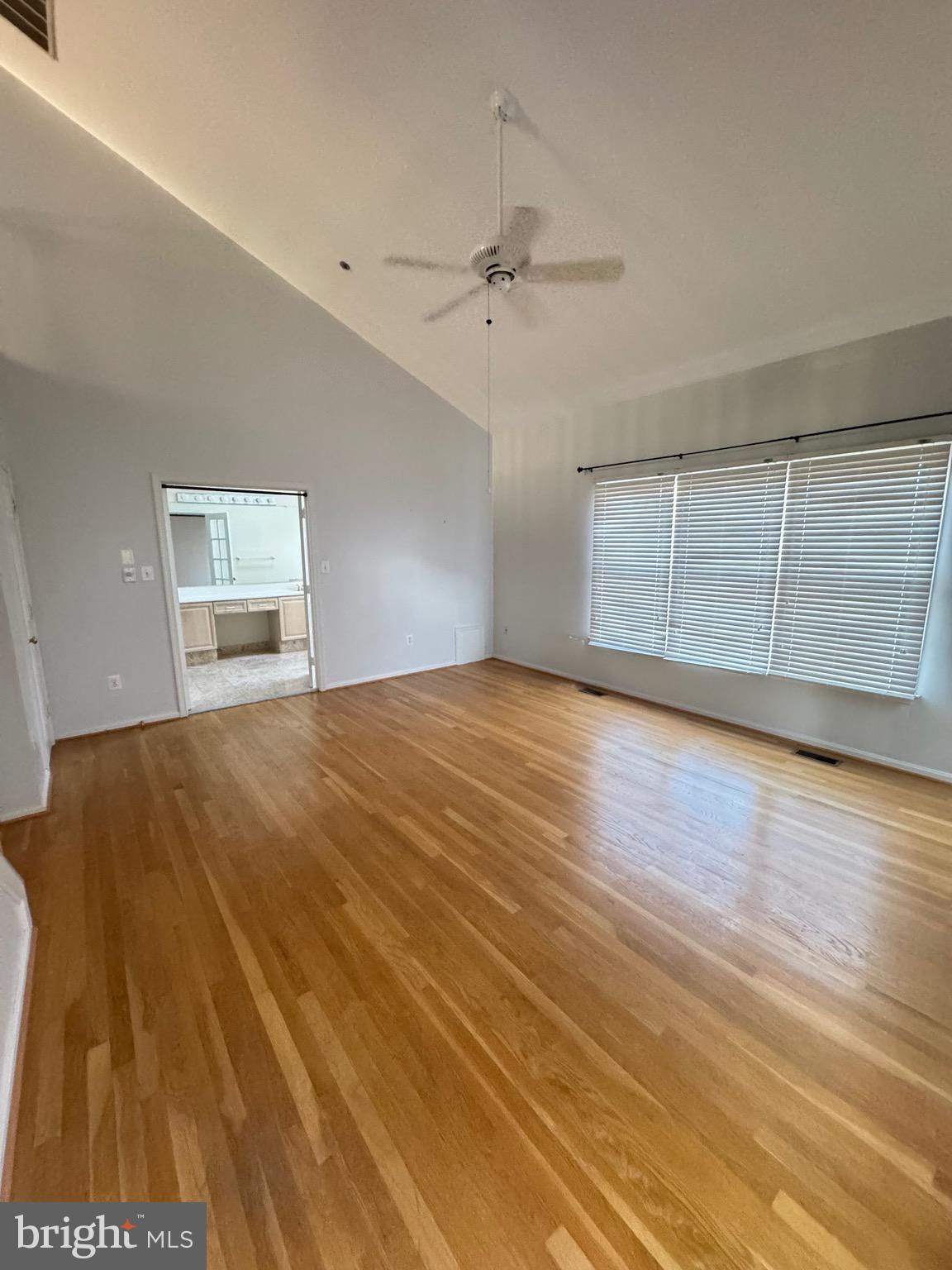 1713 Leighton Wood Lane Silver Spring, MD 20910 - Photo 29 of 47 an empty room with wooden floor cabinet and windows