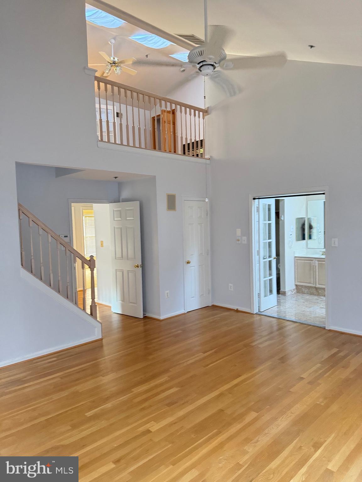 1713 Leighton Wood Lane Silver Spring, MD 20910 - Photo 30 of 47 a view of an empty room with window and wooden floor