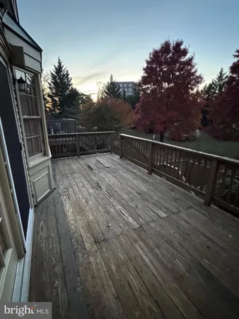 a view of balcony with wooden floor