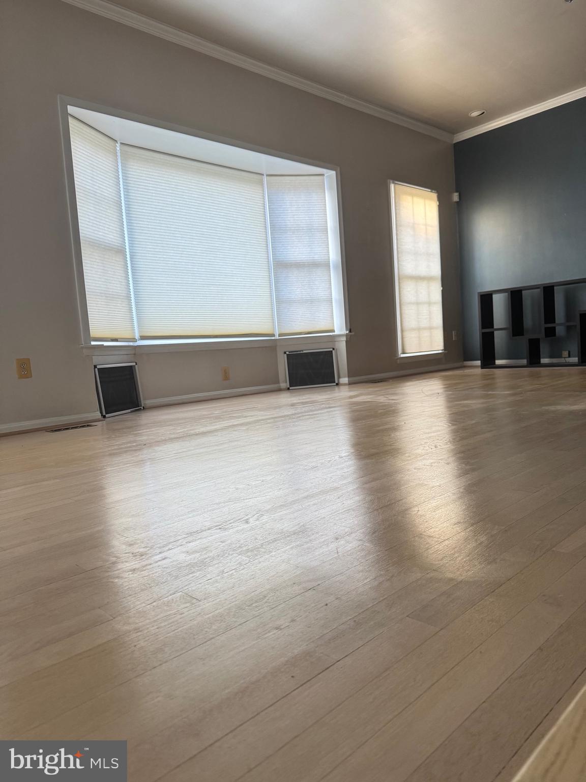 1713 Leighton Wood Lane Silver Spring, MD 20910 - Photo 5 of 47 an empty room with wooden floor and windows