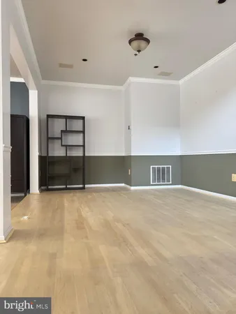 a view of empty room with windows