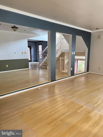 a view of an entryway with wooden floor