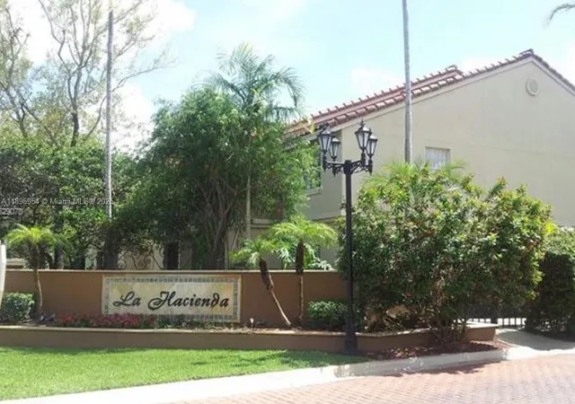 a view of a sign in front of a white house